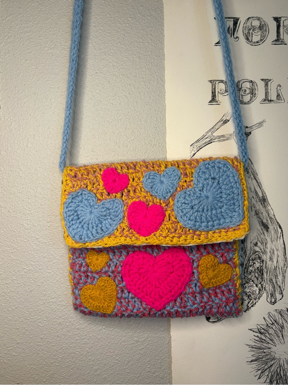 handmade “lowkey pansexual” crocheted crossbody bag